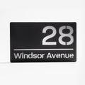 Modern matt black house sign with silver mirror backing – personalised acrylic design