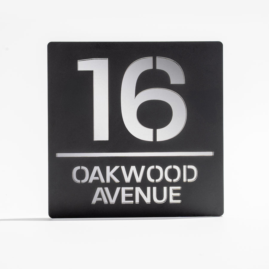 Matt black metallic house sign with silver mirror backing – modern acrylic design installed on wall