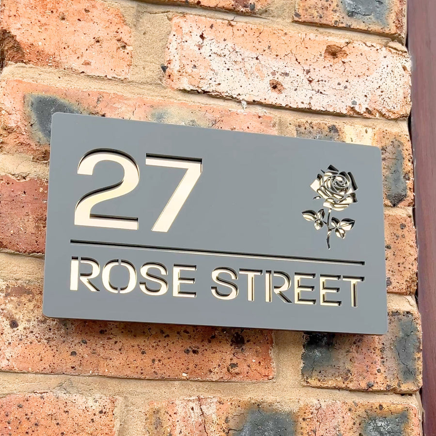 Rose floral house sign in matt grey with gold mirror backing – flat lay