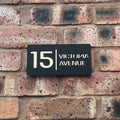 Stick on house sign in matt black with gold mirror backing – no-drill acrylic sign installed