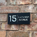 Stick on house sign in matt black with silver mirror backing – no-drill acrylic sign installed