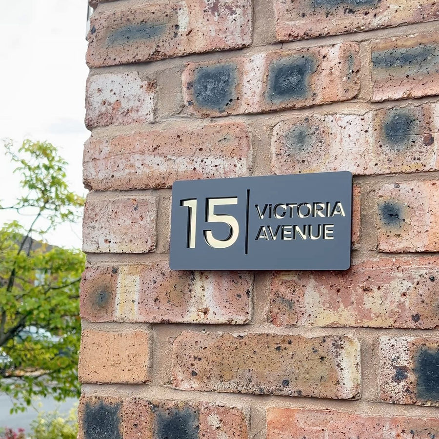 Matt grey stick on house sign with gold mirror backing – product shot