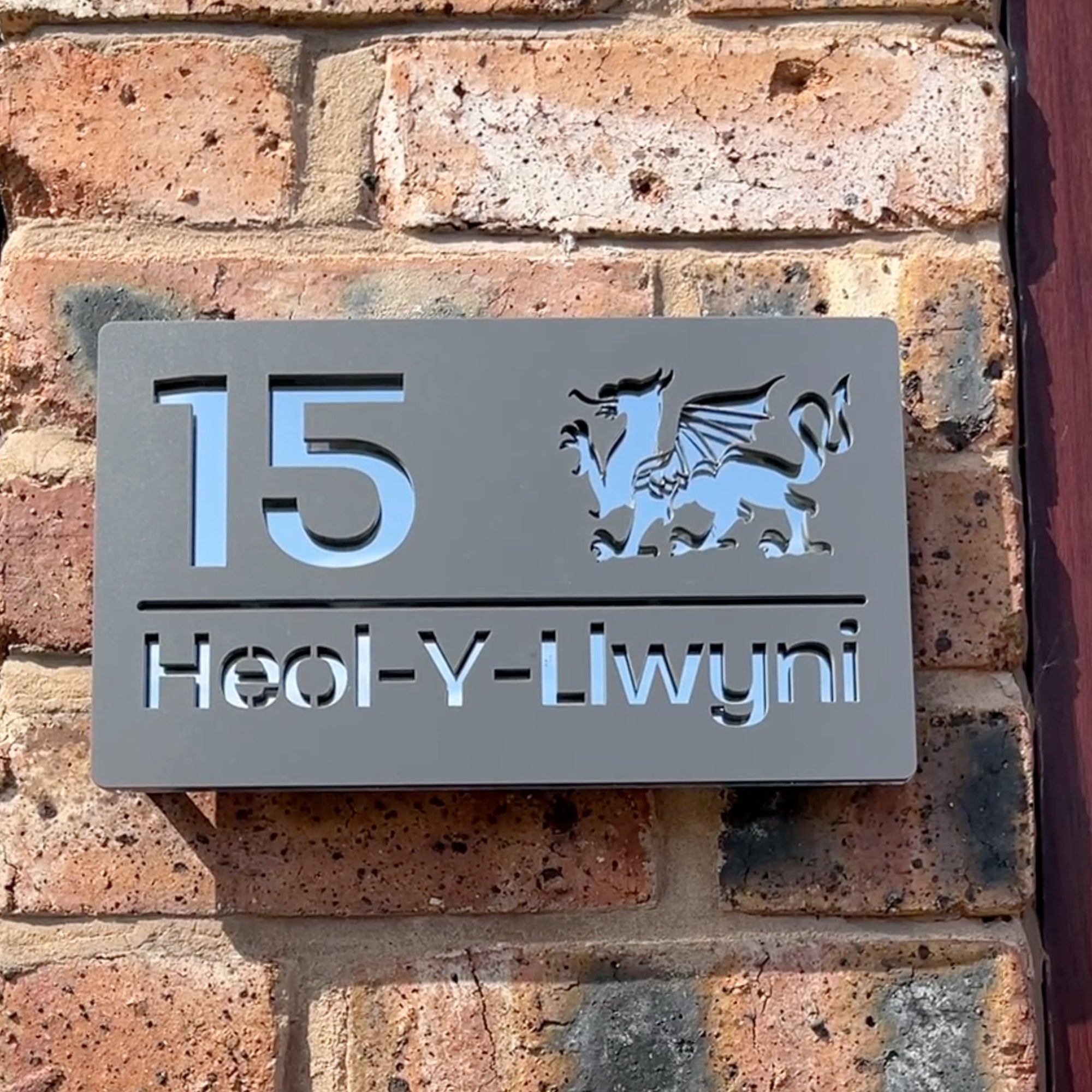Welsh Dragon house sign in matt grey with silver mirror backing – personalised acrylic design