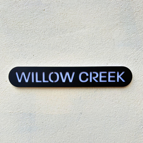 Modern house name sign installed on rendered wall – stick on acrylic