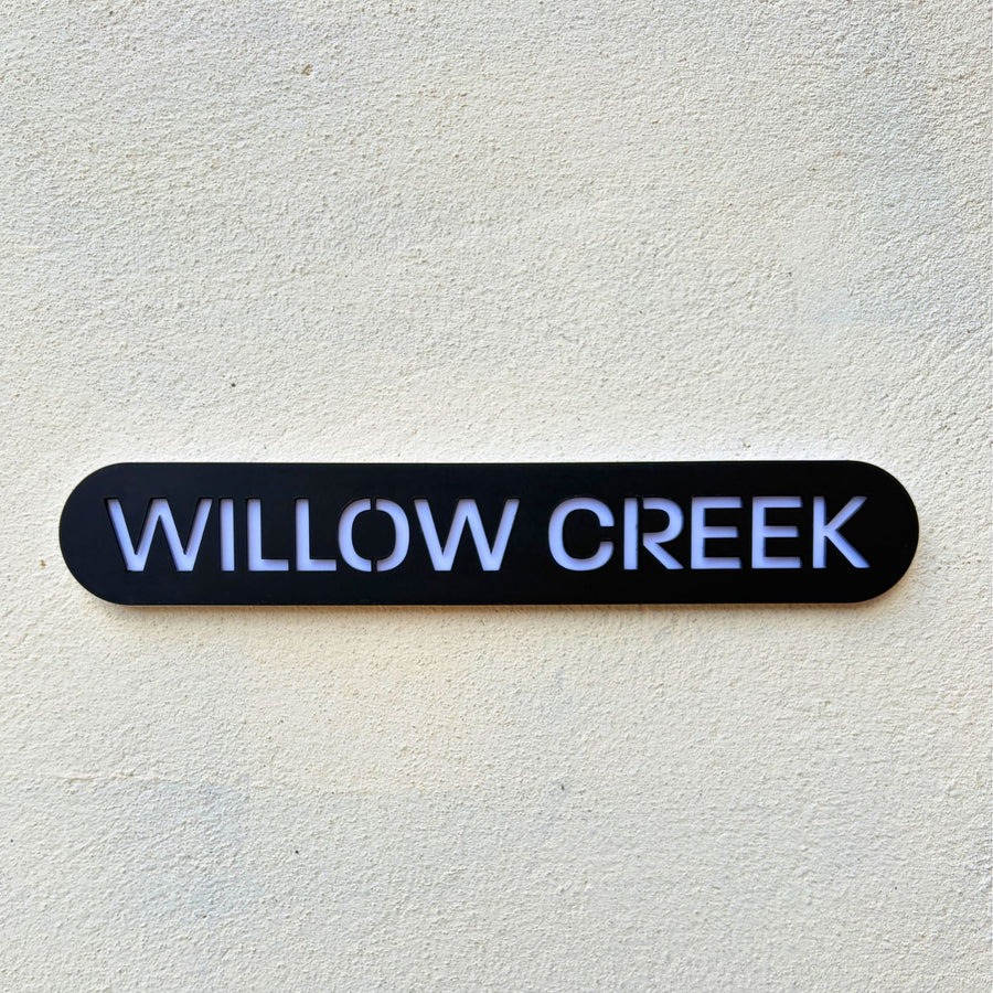 Modern house name sign installed on rendered wall – stick on acrylic