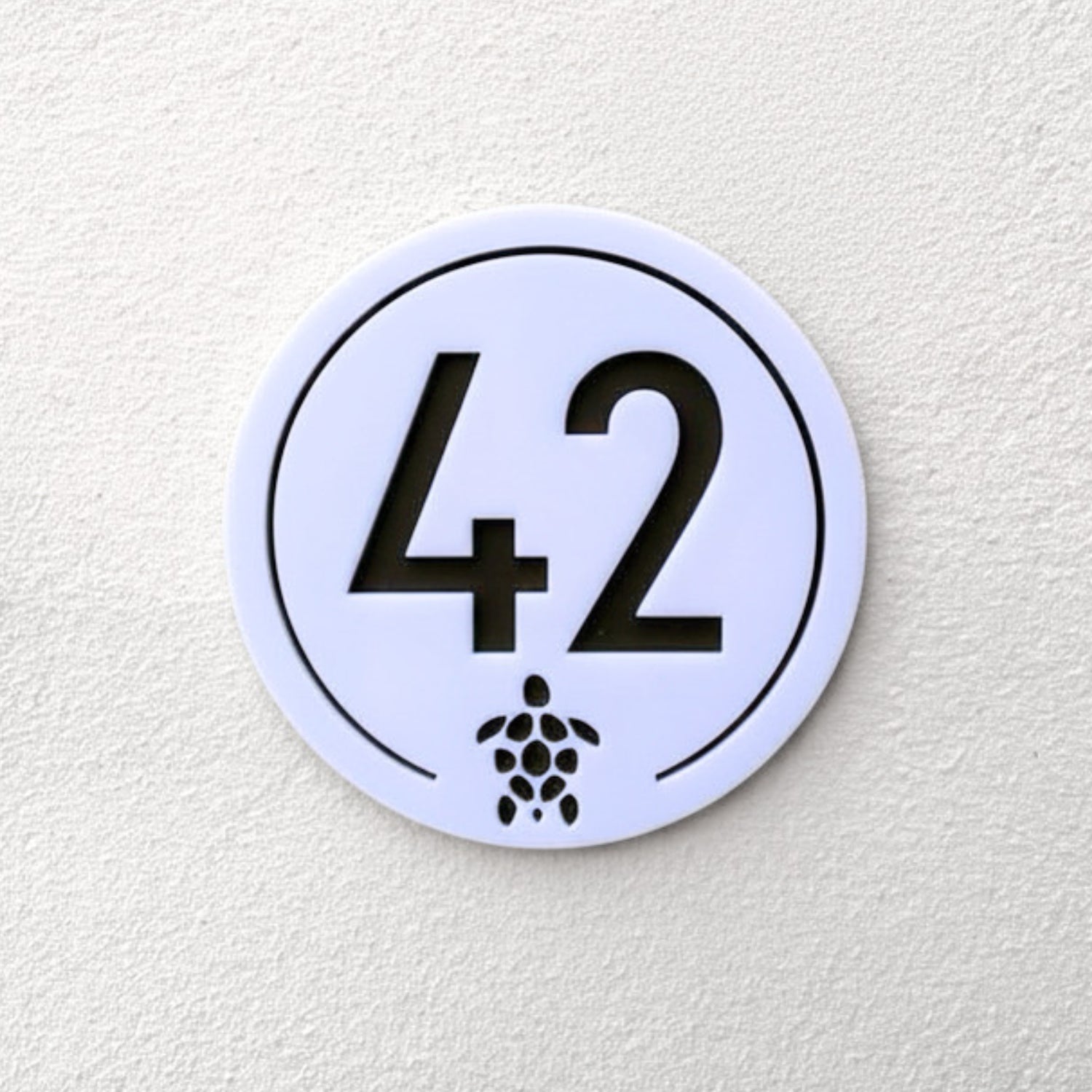 Turtle House Sign in white with house number 42 and turtle motif, front view